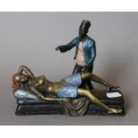A cold painted bronze model of an Arab and nude. 15 cm high.