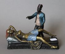 A cold painted bronze model of an Arab and nude. 15 cm high.