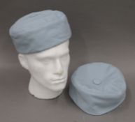 Two pale blue Lock & Co Hatters of St James's Street, cotton and quilt lined smoking caps.