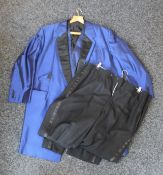 An electric blue jacket, matching waistcoat and two pairs of black evening trousers.