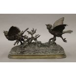 A bronze animalier sculpture formed as two birds taking flight, signed PAUTROT. 28 cm long.