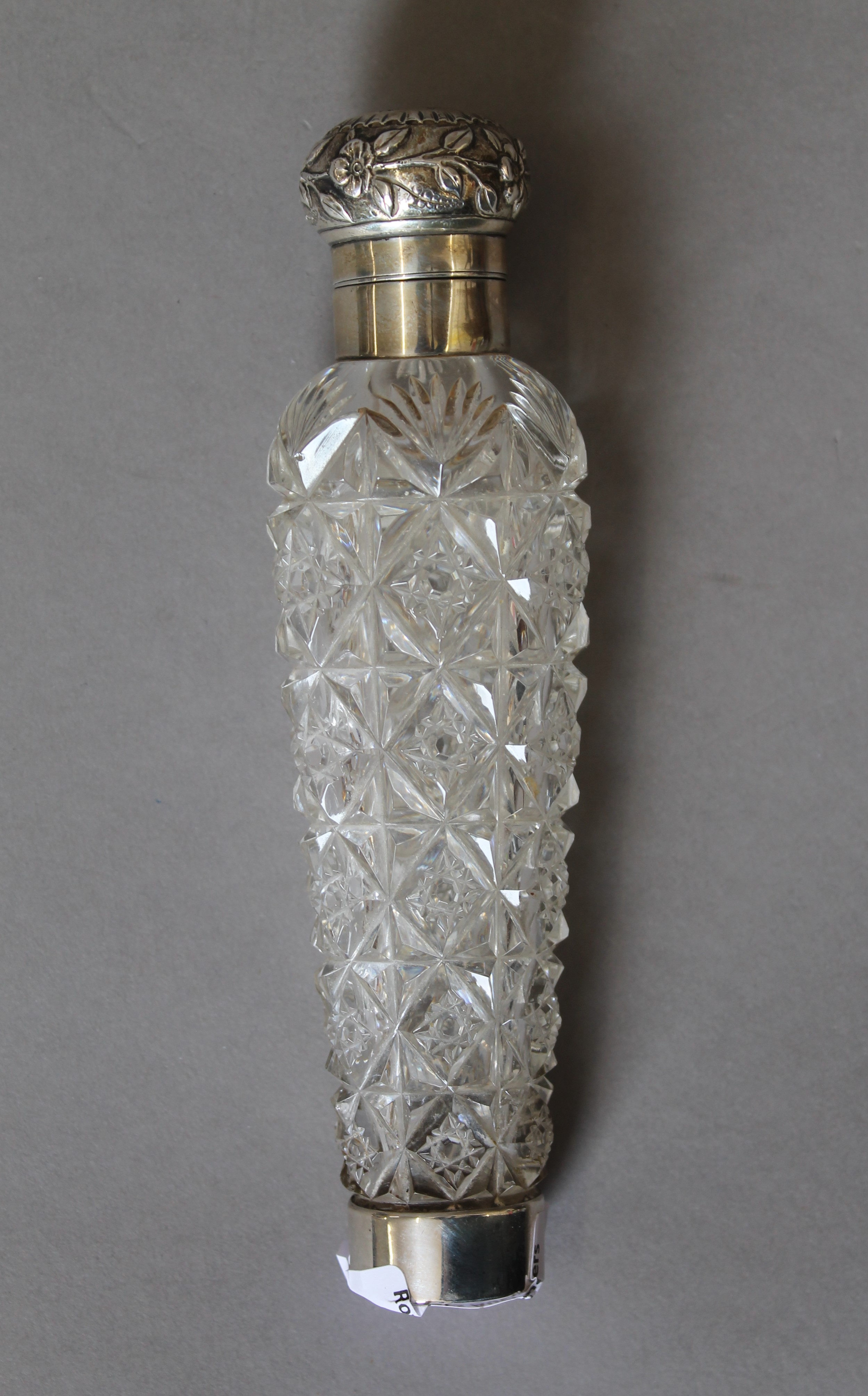 A Victorian silver mounted cut glass scent bottle. 15.5 cm long.