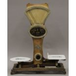 A large ornate set of grocery scales by Automatic Scale Company Altringham. 83 cm high.