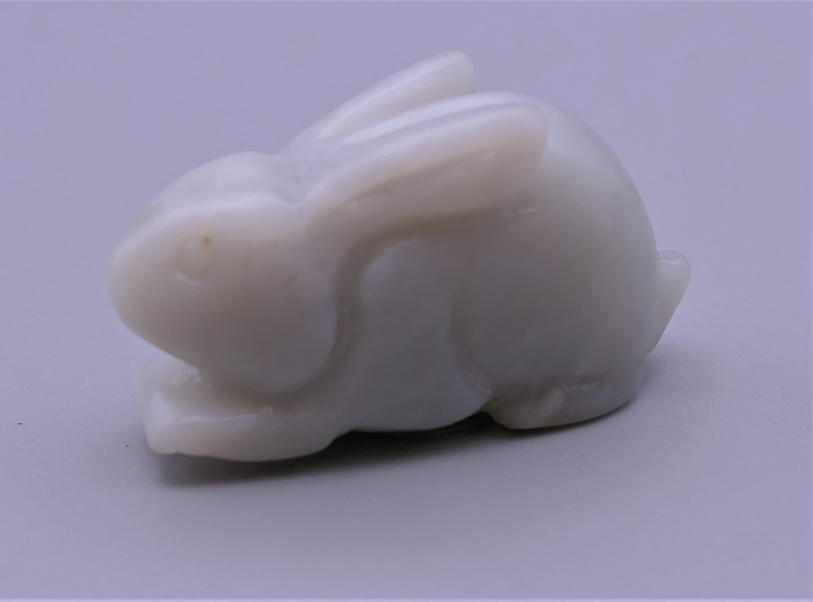 A jade carving of a rabbit. 4.5 cm long.