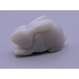 A jade carving of a rabbit. 4.5 cm long.