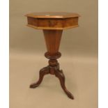 A Victorian walnut trumpet work table. 68.5 cm high.