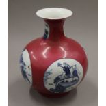 A Chinese porcelain vase decorated with boys. 25 cm high.