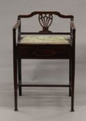 An Edwardian mahogany piano stool. 46 cm wide.