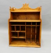 A carved pine hanging shelf. 60 cm wide.