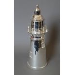 A silver plated lighthouse form cocktail shaker. 35 cm high.