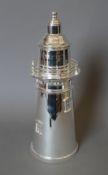 A silver plated lighthouse form cocktail shaker. 35 cm high.