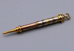 An unmarked four coloured gold propelling pencil set with agate seal top. 5 cm long retracted. 14.