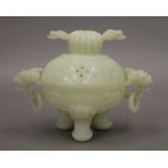 A Chinese carved jade lidded censer. 10 cm high.