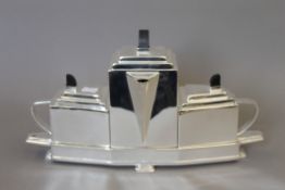 An Art Deco style silver plated tea set. 38 cm wide.