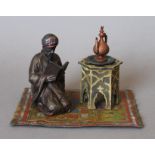 A cold painted bronze Arab form inkwell. 14.5 cm wide.