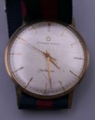 A gentleman's 9 ct gold cased Eternamatic wristwatch. 3.25 cm wide.