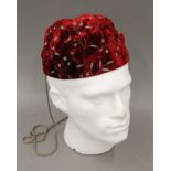 A red Favourbrook of Jermyn Street embroidered velvet smoking cap. Approximate size 7 1/8.