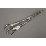 A pair of silver grape scissors. 18 cm long. 136.4 grammes.