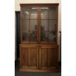 A modern mahogany bookcase cabinet. 124 cm wide x 216.5 cm high.