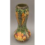 A 1997 Moorcroft Flame of the Forest pattern vase by Philip Gibson, boxed. 28 cm high.