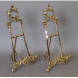 A pair of brass table easels. Each 52 cm high.