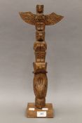 A vintage American Indian carved wood totem of typical form, possibly Haida. 46.5 cm high.