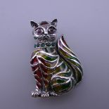 A silver and plique a jour cat brooch. 3.5 cm high.