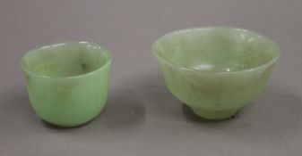 Two jade bowls. The largest 8.25 cm diameter.