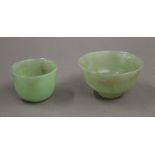 Two jade bowls. The largest 8.25 cm diameter.