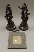 Two spelter figures and a photograph frame. The former 34 cm high.