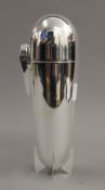 A silver plated Zeppelin cocktail shaker.