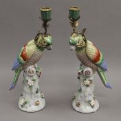 A pair of parrot form porcelain candlesticks. 36 cm high.