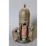 A cold painted bronze model of Arabs and a tower. 29 cm high.