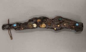 An Oriental root stick set with assorted items, including a Buddha, semi-precious stones, etc.