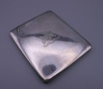 A silver cigarette case with heraldic engraving, contains letter of provenance. 8 cm wide.