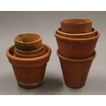 A small quantity of small terracotta plant pots. The largest 12 cm high.