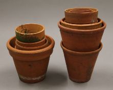 A small quantity of small terracotta plant pots. The largest 12 cm high.