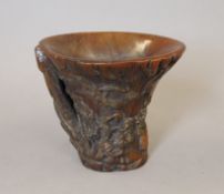 A libation cup. 12 cm high.