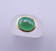 An unmarked gold jade and crystal ring. Ring size L/M.