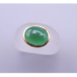 An unmarked gold jade and crystal ring. Ring size L/M.