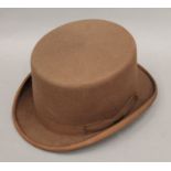 A Bermans & Nathans brown felt top hat. Approximate size 7 1/2.