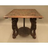 An Eastern carved hardwood table. 64 cm wide.