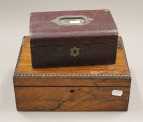 A rosewood jewellery box and a leather jewellery box. The former 28 cm wide.