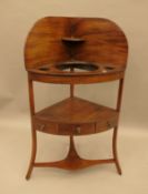 A 19th century mahogany corner washstand. 61 cm wide.