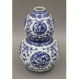 A Chinese blue and white porcelain double gourd vase. 31 cm high.