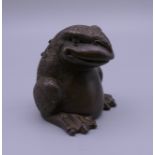 A bronze model of a toad. 4.5 cm high.