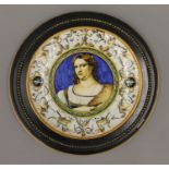 An antique faience dish mounted in ebonised framed. 31 cm diameter.