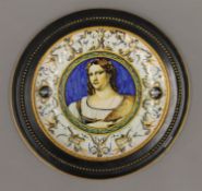 An antique faience dish mounted in ebonised framed. 31 cm diameter.