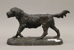 A patinated cast metal model of a retriever. 26 cm long.