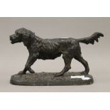 A patinated cast metal model of a retriever. 26 cm long.